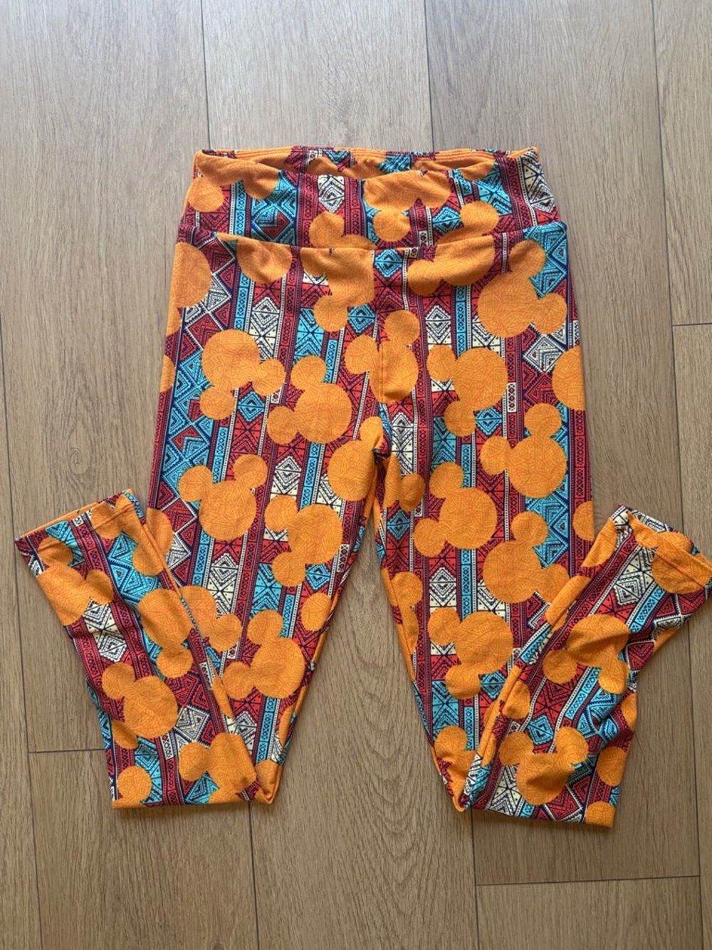 LuLaRoe Orange, Turquoise & Red Geometric Disney Bubble Leggings